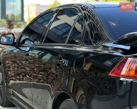 Черный Мицубиси Лансер, объемом двигателя 2 л и пробегом 205 тыс. км за 6500 $, фото 2 на Automoto.ua