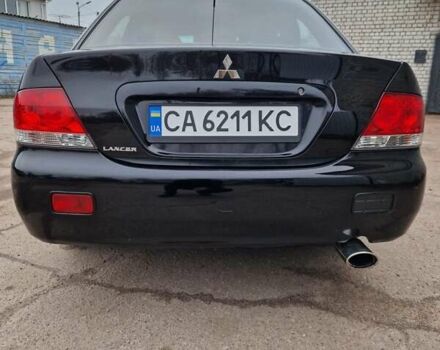 Чорний Міцубісі Lancer, об'ємом двигуна 1.6 л та пробігом 273 тис. км за 3999 $, фото 14 на Automoto.ua