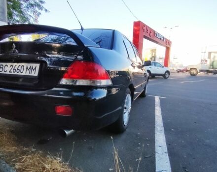 Чорний Міцубісі Lancer, об'ємом двигуна 1.6 л та пробігом 221 тис. км за 4600 $, фото 4 на Automoto.ua