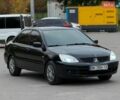 Черный Мицубиси Лансер, объемом двигателя 1.6 л и пробегом 245 тыс. км за 3000 $, фото 1 на Automoto.ua