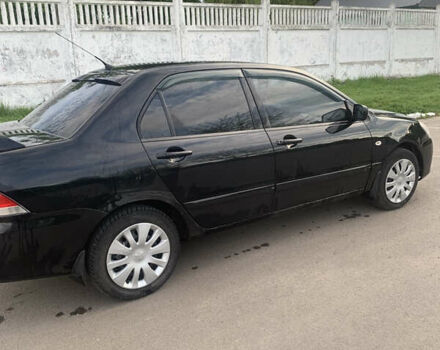 Черный Мицубиси Лансер, объемом двигателя 1.5 л и пробегом 248 тыс. км за 3200 $, фото 6 на Automoto.ua