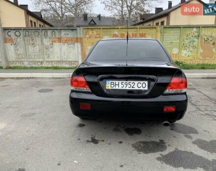 Черный Мицубиси Лансер, объемом двигателя 1.6 л и пробегом 164 тыс. км за 5200 $, фото 1 на Automoto.ua