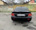 Черный Мицубиси Лансер, объемом двигателя 1.6 л и пробегом 164 тыс. км за 5200 $, фото 1 на Automoto.ua