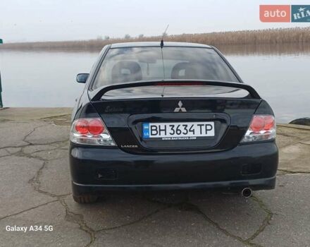 Черный Мицубиси Лансер, объемом двигателя 2 л и пробегом 286 тыс. км за 4000 $, фото 8 на Automoto.ua