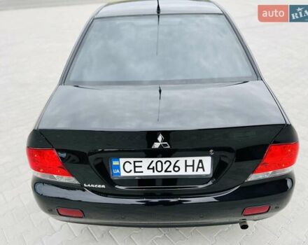 Чорний Міцубісі Lancer, об'ємом двигуна 1.6 л та пробігом 243 тис. км за 4950 $, фото 9 на Automoto.ua