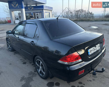 Черный Мицубиси Лансер, объемом двигателя 1.6 л и пробегом 315 тыс. км за 4000 $, фото 2 на Automoto.ua