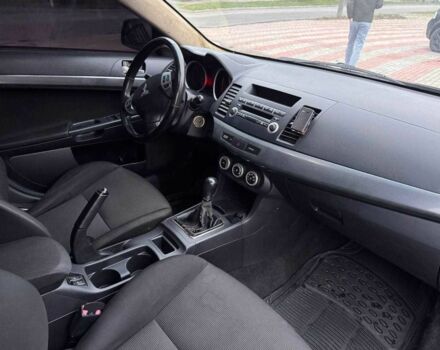 Черный Мицубиси Лансер, объемом двигателя 2 л и пробегом 217 тыс. км за 5500 $, фото 8 на Automoto.ua