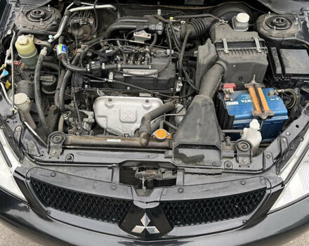 Чорний Міцубісі Lancer, об'ємом двигуна 1.58 л та пробігом 256 тис. км за 4200 $, фото 9 на Automoto.ua