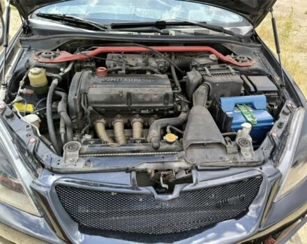 Черный Мицубиси Лансер, объемом двигателя 2 л и пробегом 161 тыс. км за 4500 $, фото 2 на Automoto.ua