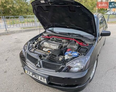 Чорний Міцубісі Lancer, об'ємом двигуна 2 л та пробігом 152 тис. км за 5500 $, фото 22 на Automoto.ua