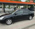 Чорний Міцубісі Lancer, об'ємом двигуна 1.58 л та пробігом 168 тис. км за 4750 $, фото 1 на Automoto.ua
