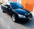 Черный Мицубиси Лансер, объемом двигателя 1.6 л и пробегом 300 тыс. км за 4800 $, фото 1 на Automoto.ua