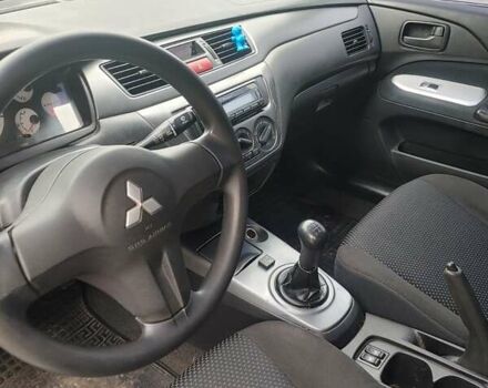 Чорний Міцубісі Lancer, об'ємом двигуна 1.58 л та пробігом 190 тис. км за 3750 $, фото 13 на Automoto.ua