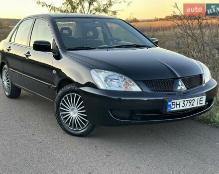 Черный Мицубиси Лансер, объемом двигателя 1.58 л и пробегом 139 тыс. км за 5200 $, фото 9 на Automoto.ua