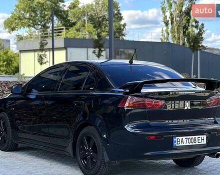 Черный Мицубиси Лансер, объемом двигателя 2 л и пробегом 205 тыс. км за 6500 $, фото 3 на Automoto.ua