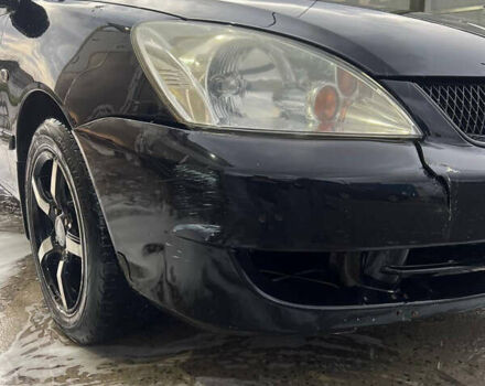 Черный Мицубиси Лансер, объемом двигателя 1.6 л и пробегом 180 тыс. км за 3499 $, фото 2 на Automoto.ua