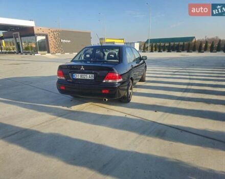 Чорний Міцубісі Lancer, об'ємом двигуна 1.59 л та пробігом 180 тис. км за 4999 $, фото 4 на Automoto.ua