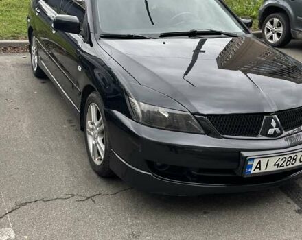 Черный Мицубиси Лансер, объемом двигателя 2 л и пробегом 219 тыс. км за 4400 $, фото 1 на Automoto.ua