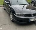 Черный Мицубиси Лансер, объемом двигателя 2 л и пробегом 219 тыс. км за 4400 $, фото 1 на Automoto.ua