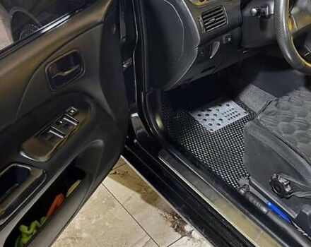 Черный Мицубиси Лансер, объемом двигателя 1.6 л и пробегом 249 тыс. км за 5000 $, фото 13 на Automoto.ua