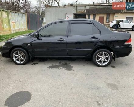 Черный Мицубиси Лансер, объемом двигателя 1.6 л и пробегом 164 тыс. км за 5200 $, фото 3 на Automoto.ua