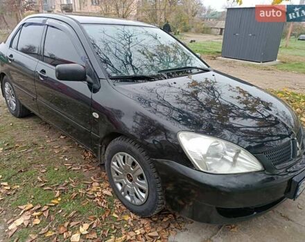 Чорний Міцубісі Lancer, об'ємом двигуна 1.58 л та пробігом 227 тис. км за 4100 $, фото 1 на Automoto.ua