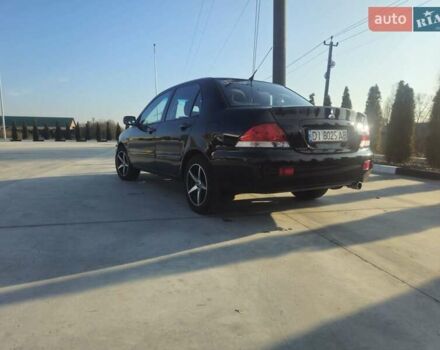 Чорний Міцубісі Lancer, об'ємом двигуна 1.59 л та пробігом 180 тис. км за 4999 $, фото 3 на Automoto.ua