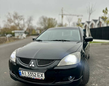 Черный Мицубиси Лансер, объемом двигателя 2 л и пробегом 260 тыс. км за 5300 $, фото 7 на Automoto.ua