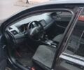 Черный Мицубиси Лансер, объемом двигателя 2 л и пробегом 267 тыс. км за 6000 $, фото 30 на Automoto.ua