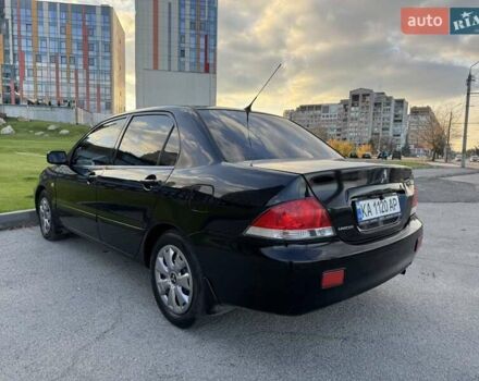 Черный Мицубиси Лансер, объемом двигателя 1.58 л и пробегом 237 тыс. км за 3999 $, фото 12 на Automoto.ua