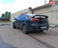 Черный Мицубиси Лансер, объемом двигателя 2 л и пробегом 280 тыс. км за 5700 $, фото 3 на Automoto.ua