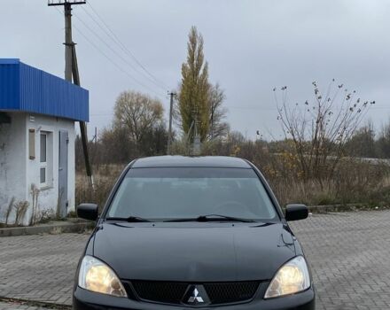 Черный Мицубиси Лансер, объемом двигателя 1.6 л и пробегом 263 тыс. км за 2900 $, фото 2 на Automoto.ua