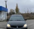 Черный Мицубиси Лансер, объемом двигателя 1.6 л и пробегом 263 тыс. км за 2900 $, фото 2 на Automoto.ua