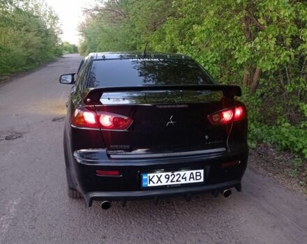 Черный Мицубиси Лансер, объемом двигателя 2 л и пробегом 245 тыс. км за 7500 $, фото 1 на Automoto.ua