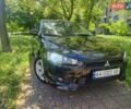 Черный Мицубиси Лансер, объемом двигателя 2 л и пробегом 300 тыс. км за 5950 $, фото 1 на Automoto.ua