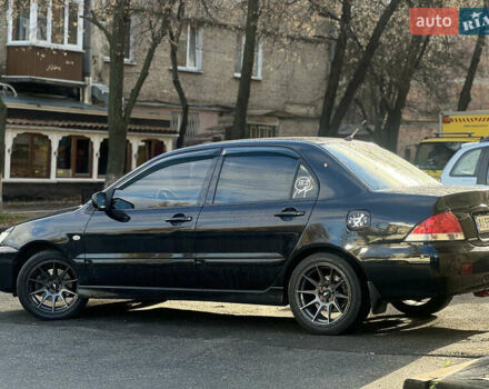 Черный Мицубиси Лансер, объемом двигателя 1.6 л и пробегом 211 тыс. км за 5700 $, фото 13 на Automoto.ua