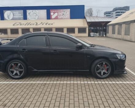 Черный Мицубиси Лансер, объемом двигателя 2 л и пробегом 160 тыс. км за 8000 $, фото 3 на Automoto.ua