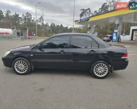 Чорний Міцубісі Lancer, об'ємом двигуна 1.58 л та пробігом 190 тис. км за 3750 $, фото 3 на Automoto.ua