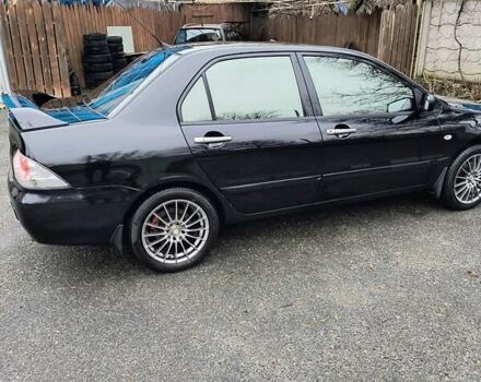 Черный Мицубиси Лансер, объемом двигателя 1.6 л и пробегом 309 тыс. км за 4000 $, фото 4 на Automoto.ua