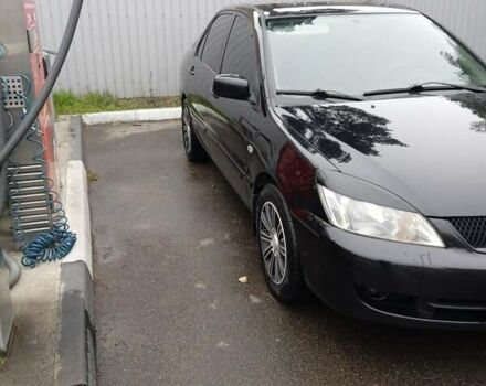 Черный Мицубиси Лансер, объемом двигателя 1.58 л и пробегом 180 тыс. км за 4500 $, фото 5 на Automoto.ua