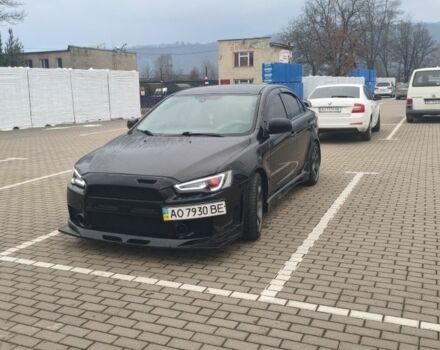 Черный Мицубиси Лансер, объемом двигателя 2 л и пробегом 160 тыс. км за 8000 $, фото 5 на Automoto.ua