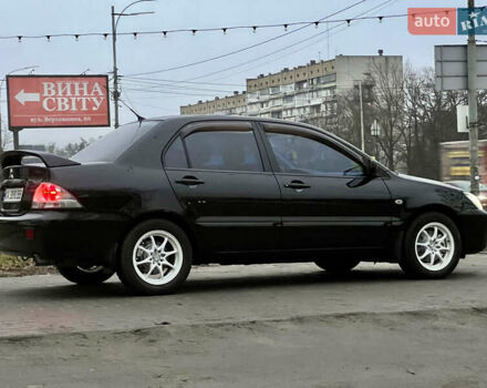 Чорний Міцубісі Lancer, об'ємом двигуна 1.6 л та пробігом 303 тис. км за 4350 $, фото 4 на Automoto.ua