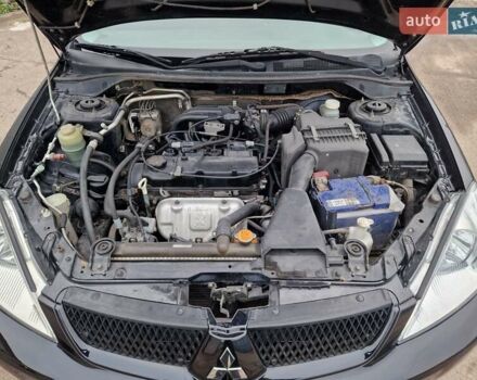 Чорний Міцубісі Lancer, об'ємом двигуна 1.6 л та пробігом 273 тис. км за 3999 $, фото 22 на Automoto.ua