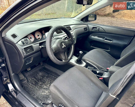 Черный Мицубиси Лансер, объемом двигателя 1.6 л и пробегом 216 тыс. км за 4990 $, фото 10 на Automoto.ua