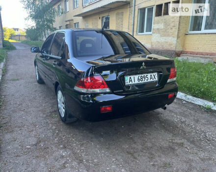 Чорний Міцубісі Lancer, об'ємом двигуна 1.58 л та пробігом 163 тис. км за 4850 $, фото 10 на Automoto.ua