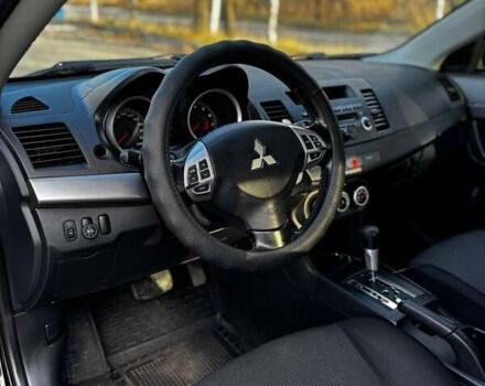 Черный Мицубиси Лансер, объемом двигателя 2 л и пробегом 224 тыс. км за 7000 $, фото 3 на Automoto.ua