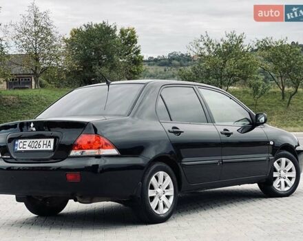 Чорний Міцубісі Lancer, об'ємом двигуна 1.6 л та пробігом 243 тис. км за 4950 $, фото 23 на Automoto.ua