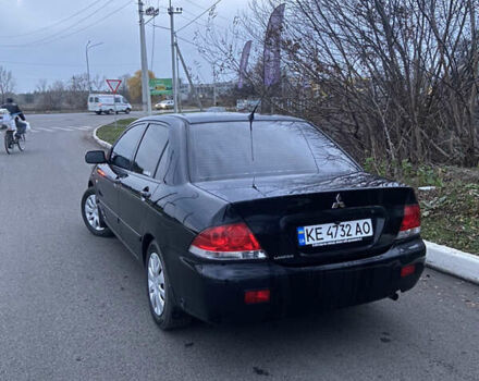 Черный Мицубиси Лансер, объемом двигателя 1.58 л и пробегом 213 тыс. км за 4900 $, фото 4 на Automoto.ua