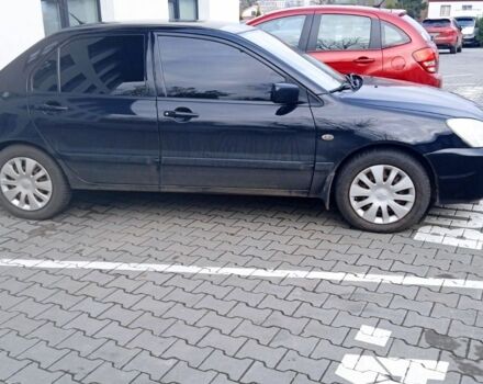 Черный Мицубиси Лансер, объемом двигателя 1.6 л и пробегом 223 тыс. км за 4300 $, фото 3 на Automoto.ua