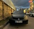 Черный Мицубиси Лансер, объемом двигателя 2 л и пробегом 225 тыс. км за 4999 $, фото 1 на Automoto.ua